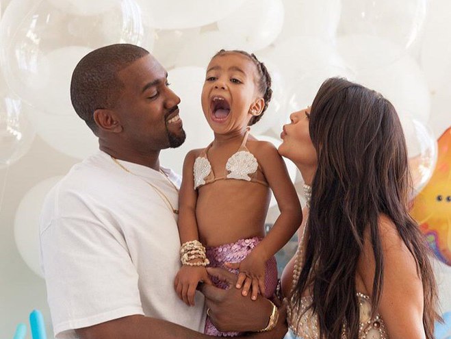 Ким Кардашьян и Канье Уэст с дочерью Норт